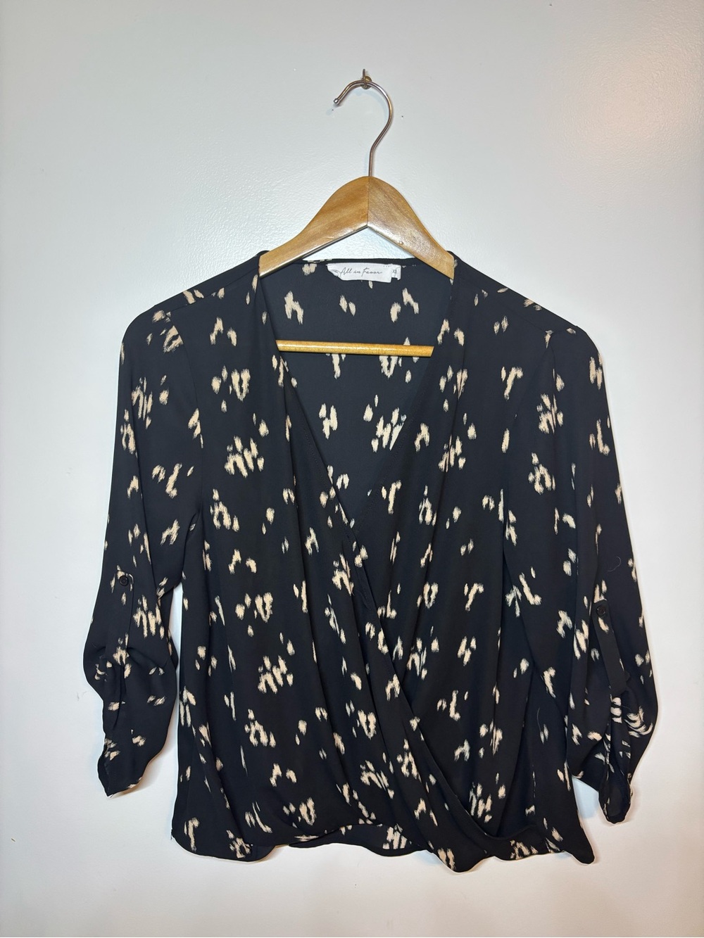 All in Favor Black & Cream Printed Faux-Wrap Blouse
